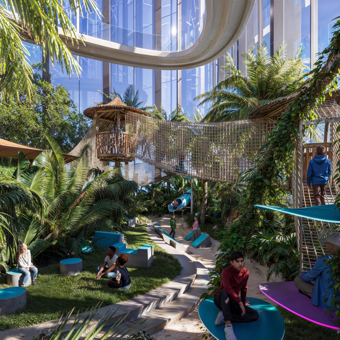 nterior view of a lush indoor rainforest with walkways and people relaxing beneath natural light.