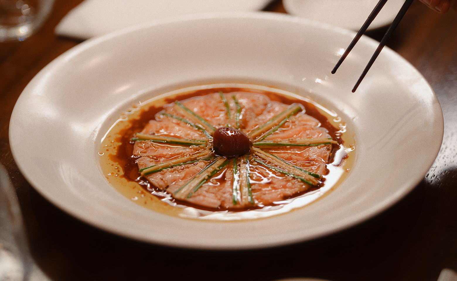 Gourmet dish artfully plated with sauce and garnish