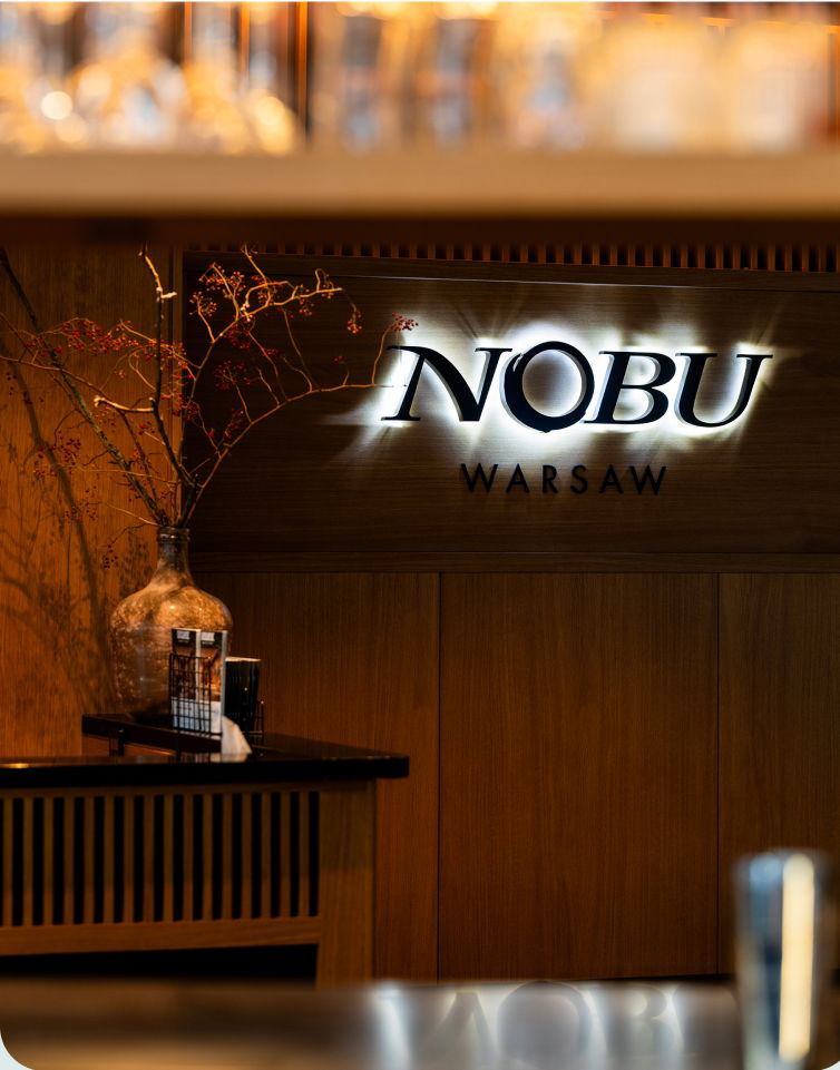 Nobu Warsaw restaurant logo on wooden wall