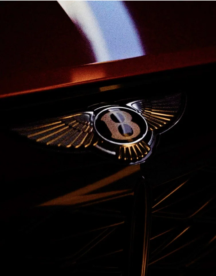 Car interior with orange and gray leather upholstery.