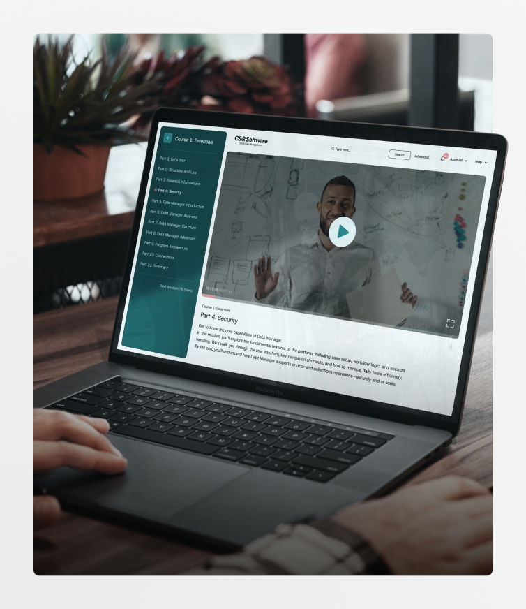 Person watching C&R Software training video on laptop screen