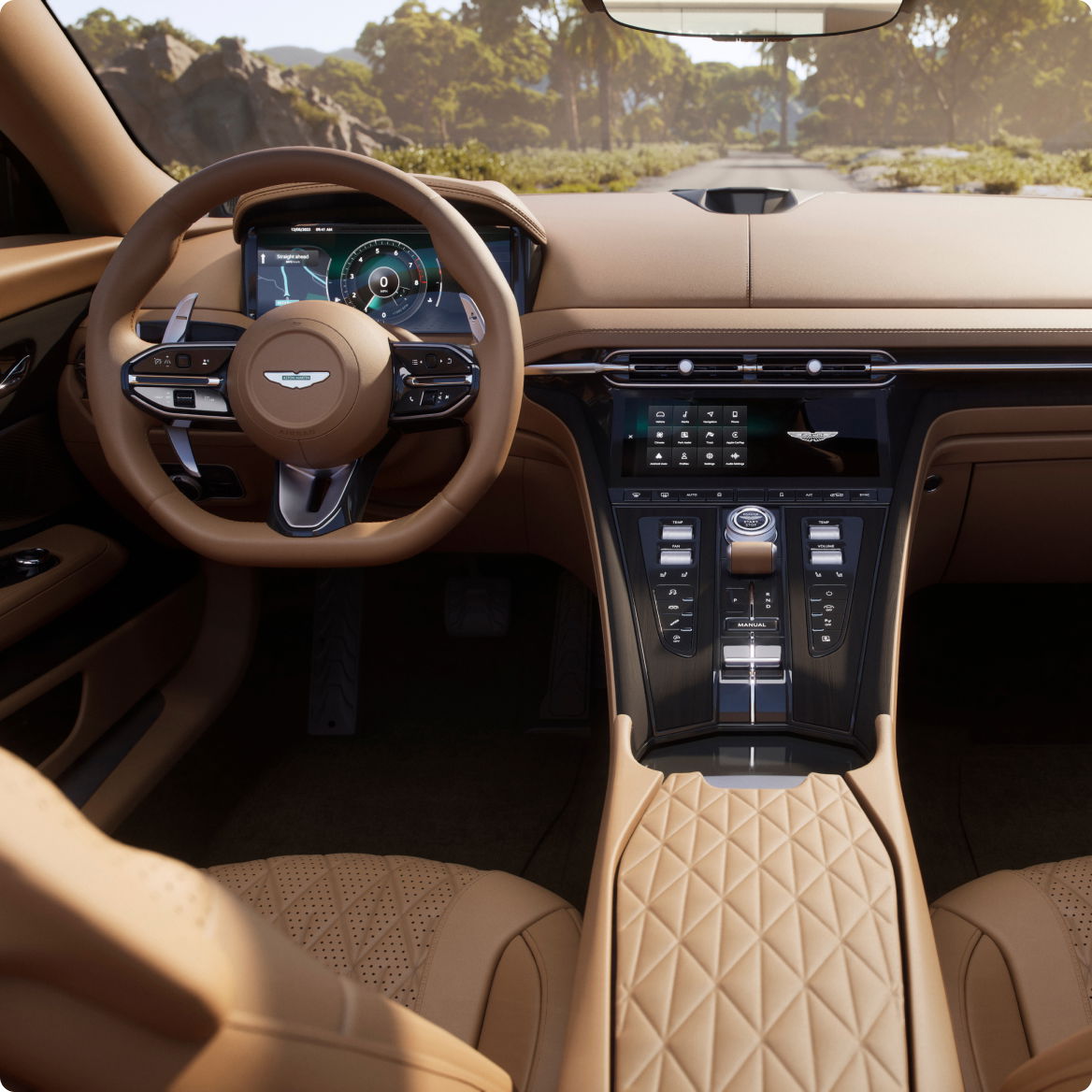 Luxury Aston Martin interior featuring tan leather seats and detailed stitching.